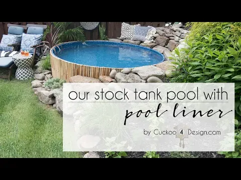 stock tank pool with pool liner built into our sloped yard