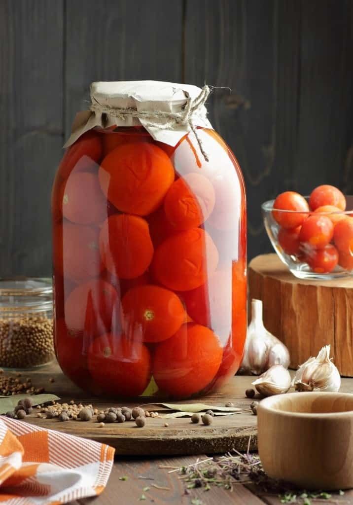 fermented cherry tomatoes and garlic jar