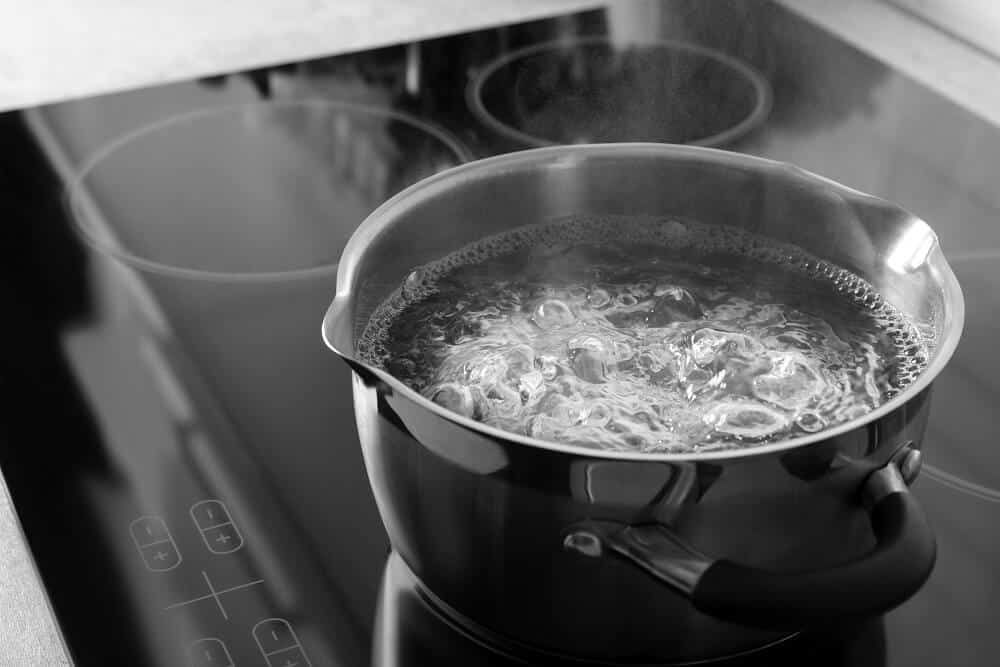 pot with boiling water on stove