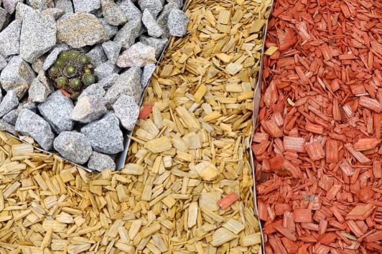 Rubber Mulch vs Wood Mulch [Complete Guide to the Pros and Cons]