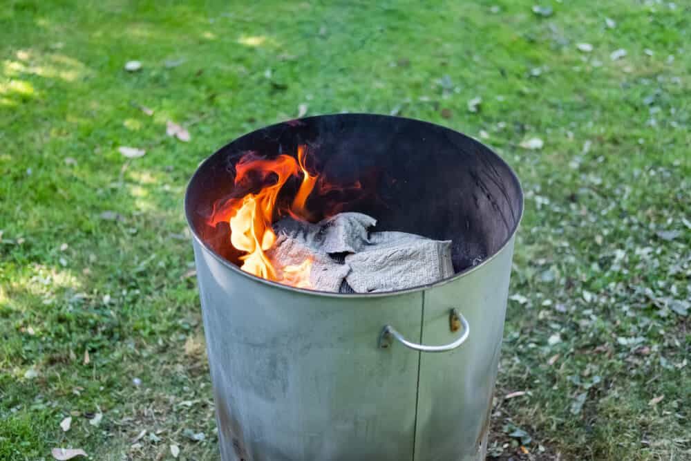 homemade metal barrel burner in garden