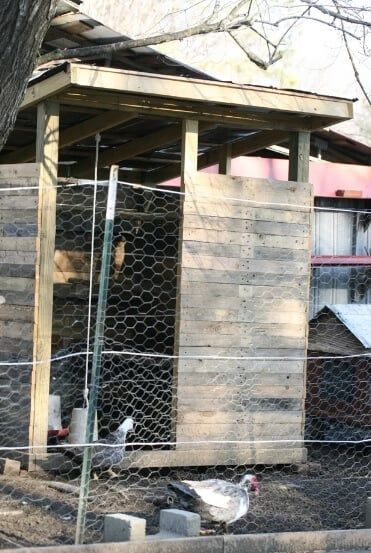 classic chicken coop made with wooden pallets
