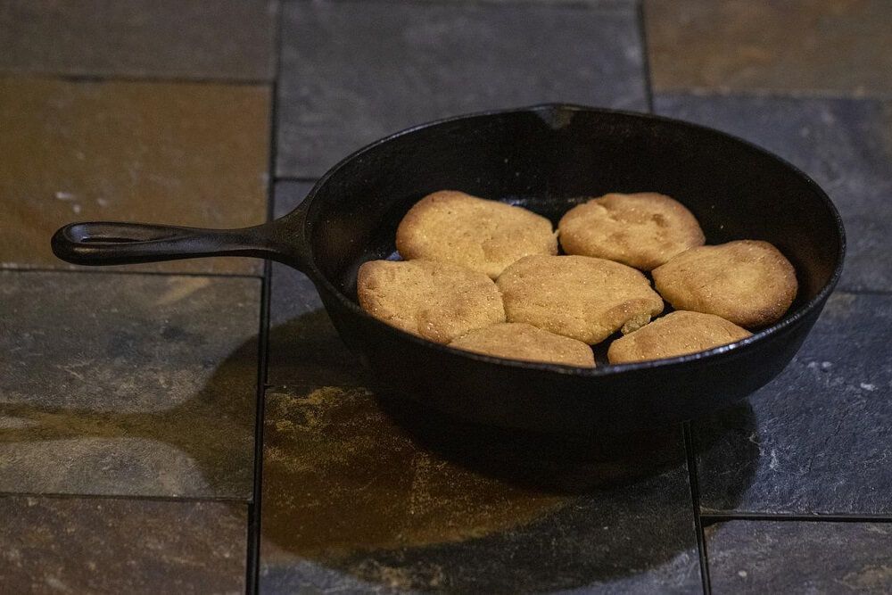 homemade cornbread in cast iron pan for baking