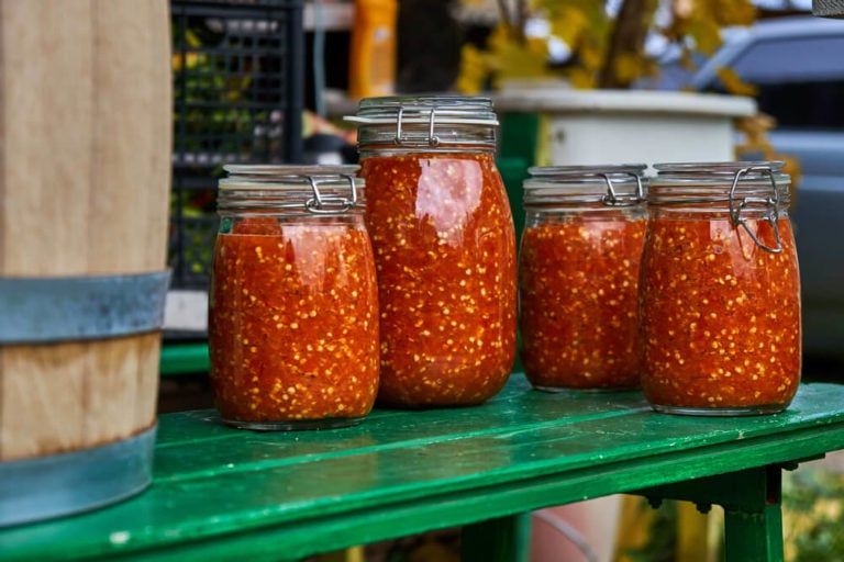 hot peppers homemade hot sauce stored inside jars