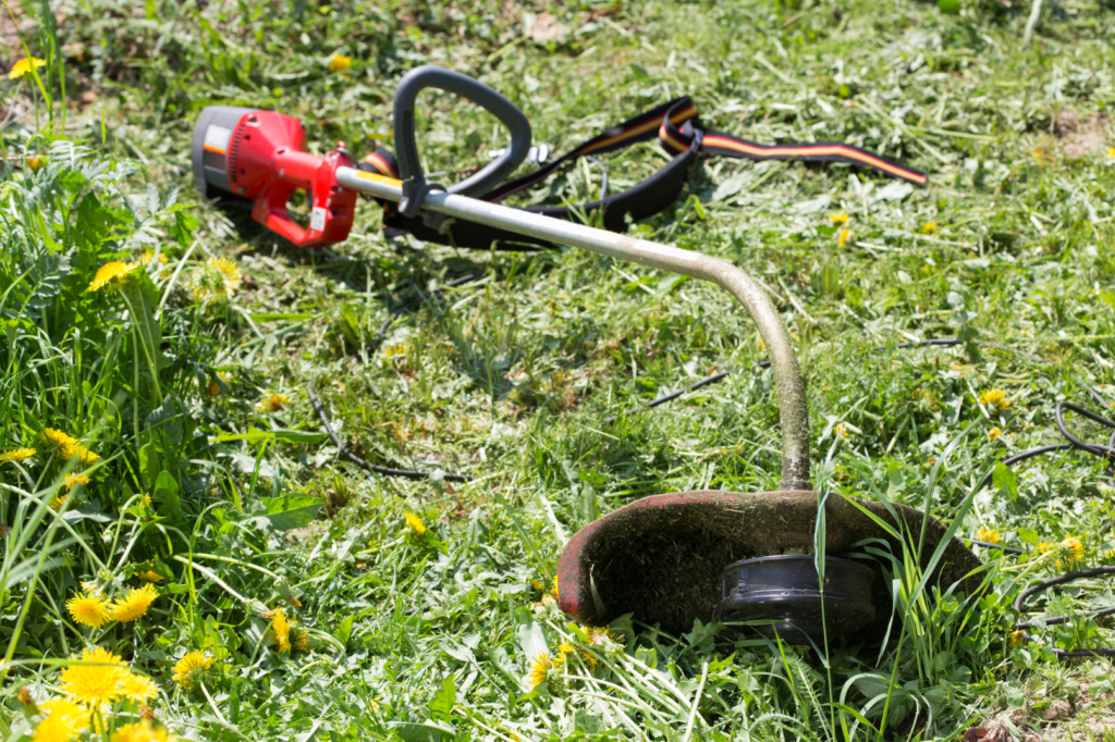 corded electric weed eater or string trimmers on lawn