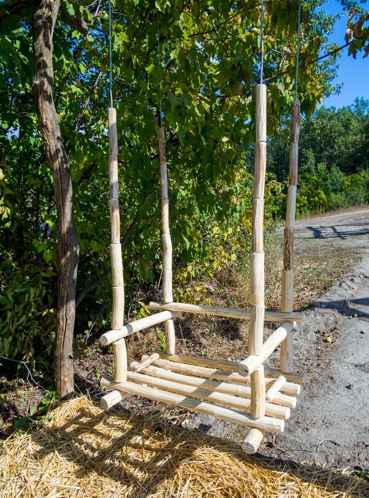 A swinging chair - one of our favorite Things to make out of logs and branches