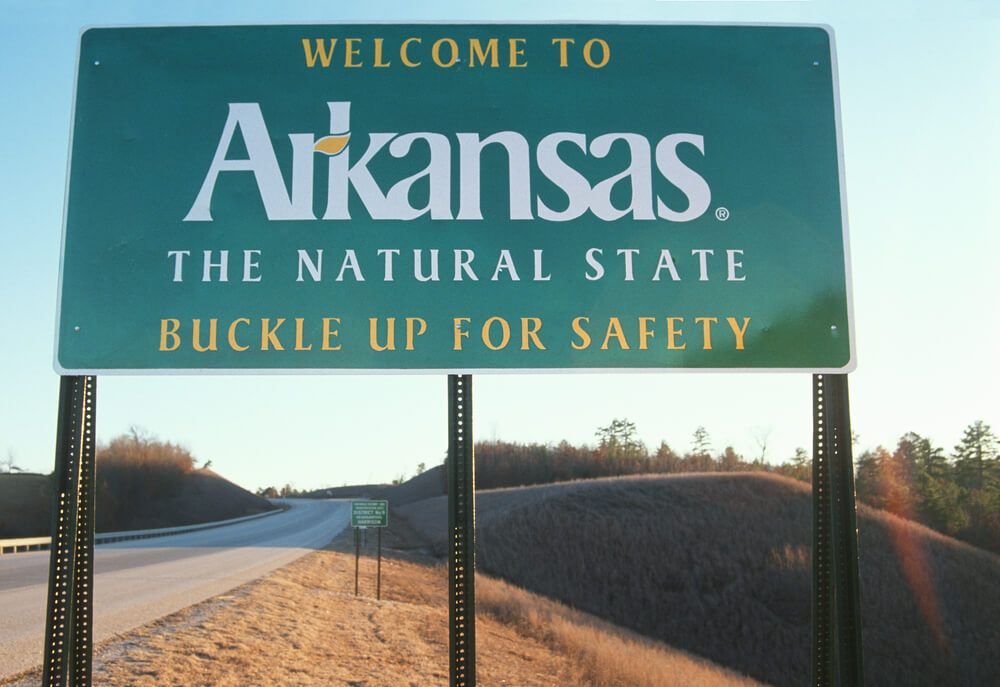 best state for homesteaders welcome to arkansas sign