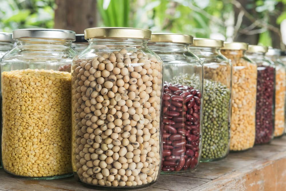 dry beans and mixed legumes in glass jars for storage