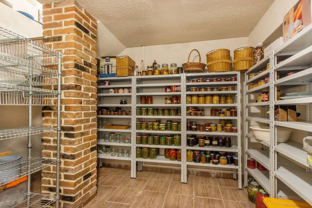 home food storage room stuffed with jarred fruits veggies and jellies