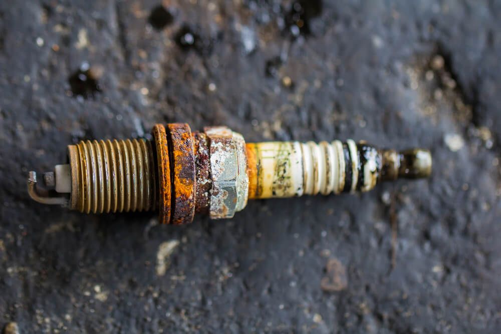 old used and damaged spark plug unfit for use