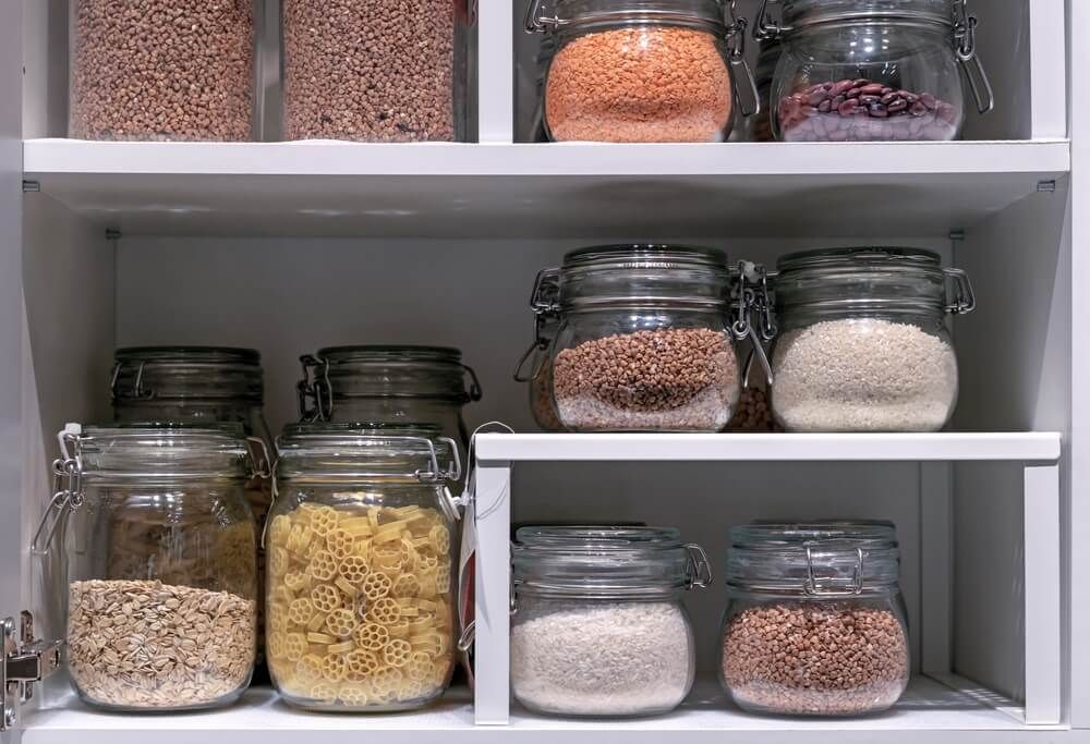 pasta grains and cereals stockpiled in glass jars for home food storage
