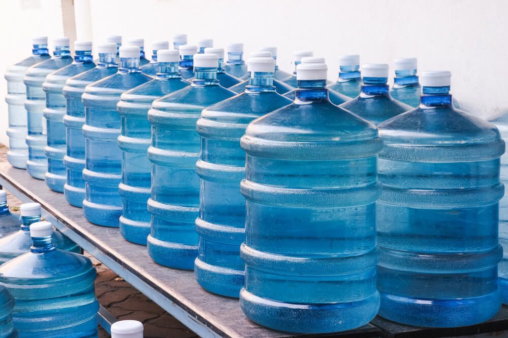 rows of big water bottles for emergency storage