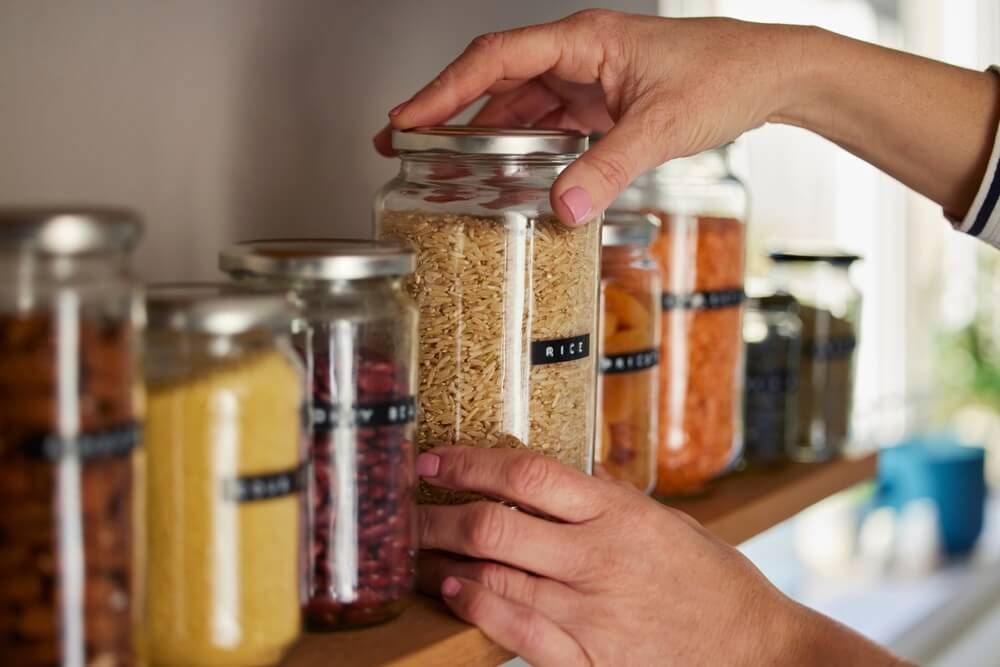 using glass jars to stockpile dried rice beans veggies and legumes