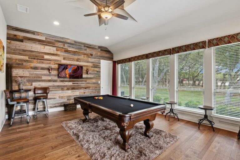 small man cave room with a pool table and chic furnishings