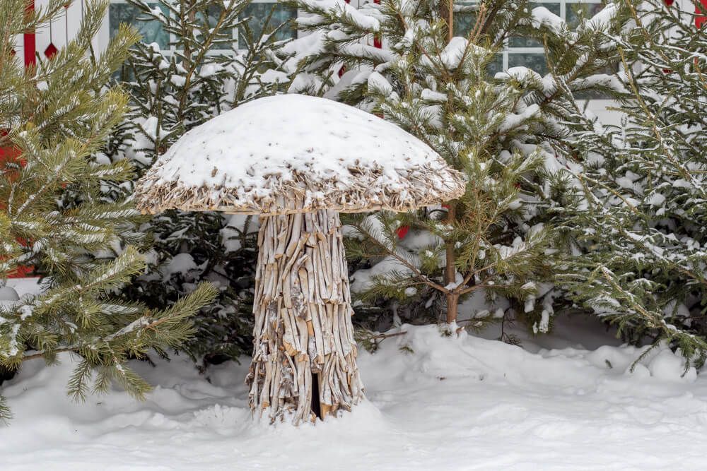 mushroom sculpture made from branches sticks and stems