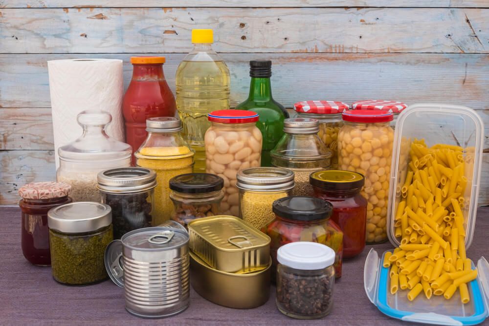 small pantry food storage with glass food jars cereals jams pasta rice and canned food
