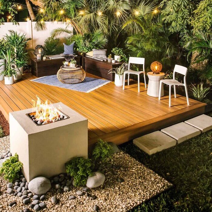epic and beautiful backyard deck with plants and comfy seating