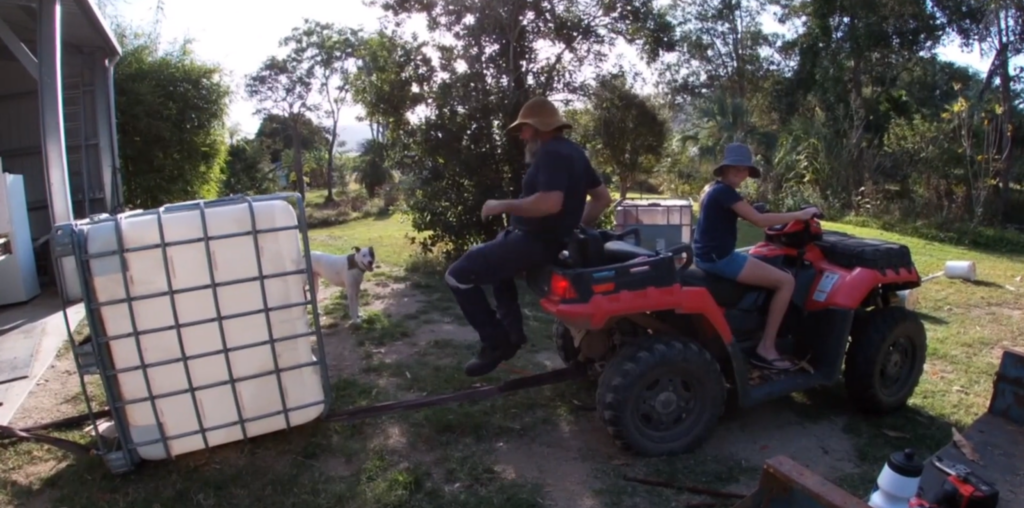 using an ATV to unbend the metal IBC frame