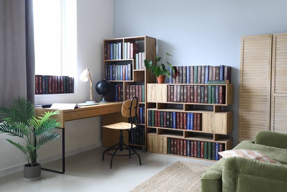 Home office with bookcases stuffed with fascinating and vintage literature.